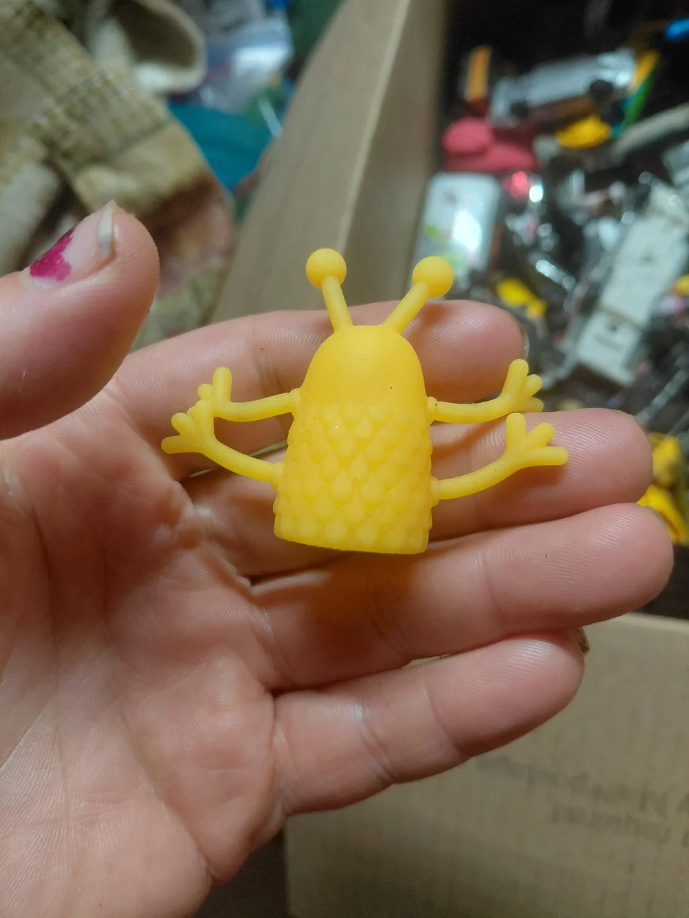 rubber alien monster finger puppet.
